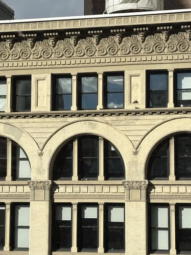 An ornate arched building facade