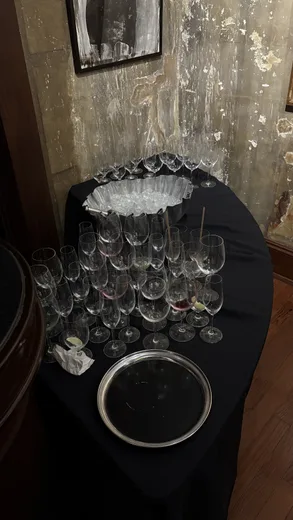 Wine glasses on a black-draped table